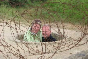 Pam & Mike poking out of a Tobruk.