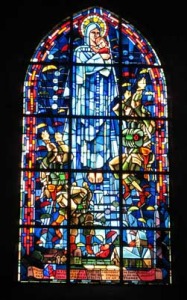 A picture of the stained glass window now in place in the church to honor the US paratroopers.