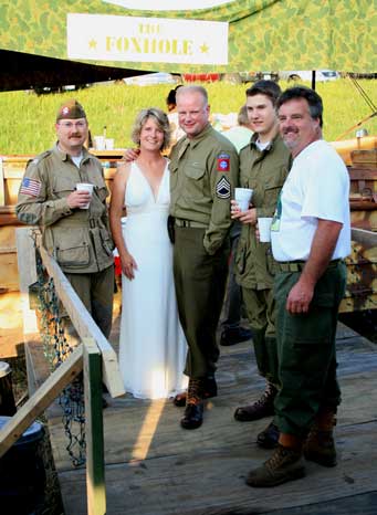 Friends in uniform ready to toast the married couple.