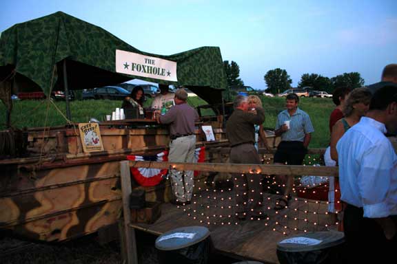 For the bar, what else but an old DUKW! Complete with a barrail, ramp and canopy, it was stocked well and also a big hit. Yes, that is me in the white Tee shirt. I opened it and closed it.