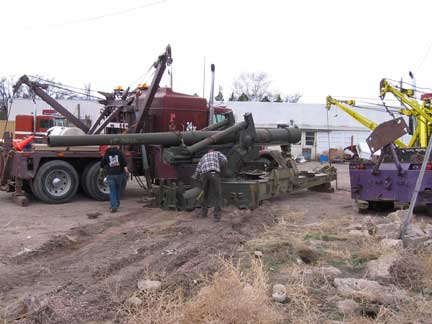 VERY, Very carefully! And not too successfully with the wrong equipment. The first guy hired to do the job used these two old Holmes wrecker units. One was destroyed in the process. After 5 hours of messing around and breaking equipment, a second company was called with the right equipment.