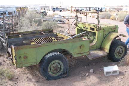Another wounded Dodge waiting its fate. A good parts truck, too much missing for a restoration.