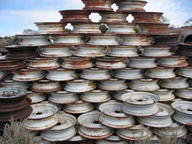 Interesting stack of wheels. All 16", we were hoping that they would work on jeeps. No such luck. There must have been 1000 wheels in the two stacks.