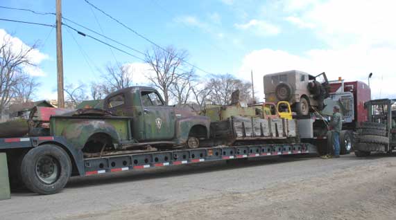 The first load getting tied down. No, the Chevy is not mine, that was purchased by Jeff. This load consisted of an M5H6 International cargo box loaded with 2 M5H6 cabs and front clips, and a ton of other loose small Dodge and Jeep parts. Jeff found a bunch of old Chevy stuff too.