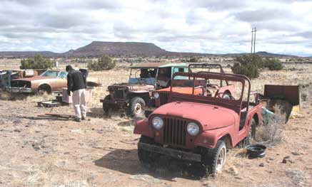 A quick side trip along the road revealed a bunch of civy jeeps. We bought what was worth hauling home and left the rest. Not much military, and less now.