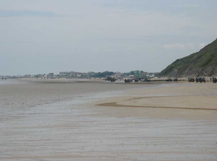 This is a very long convoy of near 400 trucks of all types headed from Ver Sur Mer down the beach at low tide headed for the Arromanches ceremony on Saturday the 6th of June. The first truck arrived and the last had yet to even start the engine.