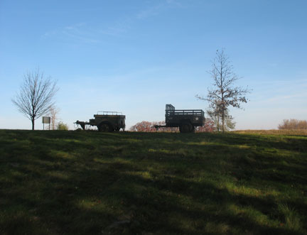 Lonely trailers sitting on the hill. M101 in nice shape and an M332 ammo trailer.