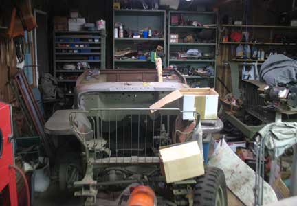 This is the second stop on the trip. Two Willys slat grills sitting in the garage. One on the left is a 1942 and the right is 12-23-41. These were both under construction and parts were scattered everywhere.