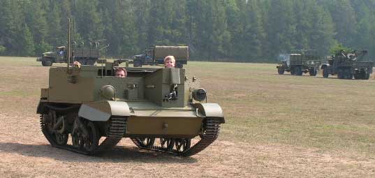 My newly restored Bren Gun Carrier. Myself driving, with sons, Braden in front and Ranon in back,(top of head only).