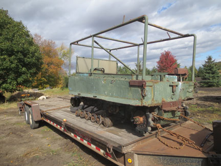 We loaded the "parts" weasel first. An uncle of the brothers was going to convert the undercarriage to a Bombardier track system and never finished it. That is why the large sprockets are on the drive axle.