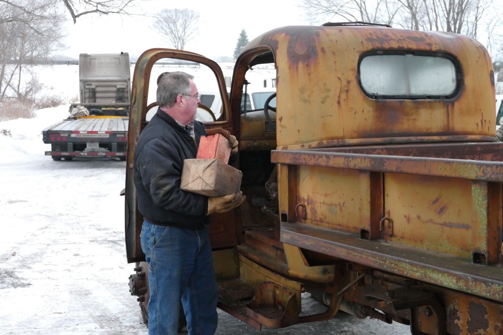 Removing parts stored in the cab.