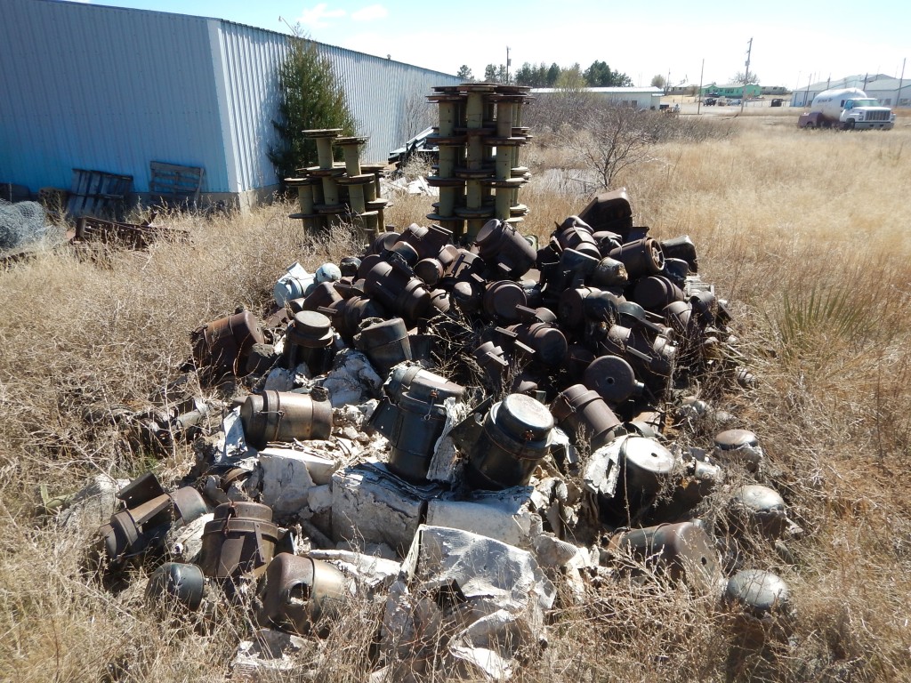 Larger cable reels stacked up next to the oil pans.