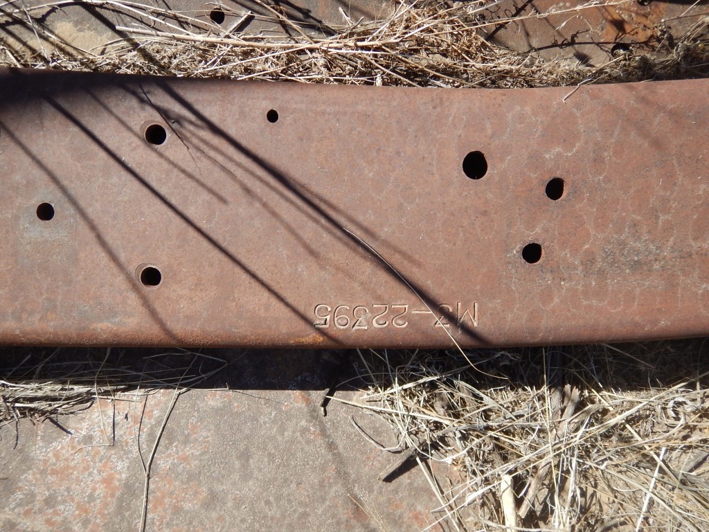 The yard was littered with halftrack frame sections. They had been cut up and used as racking for steel storage and work tables. Re-purposing at its best.