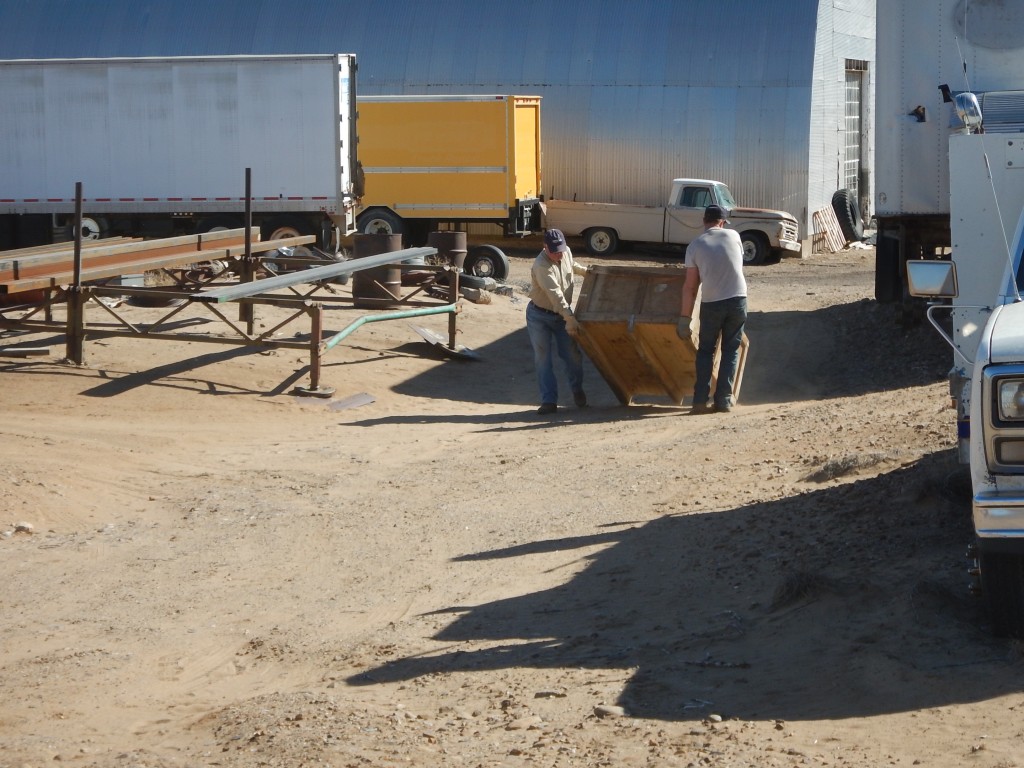 Don and Dan dragging a crate to use for loading. Forklift was unavailable.